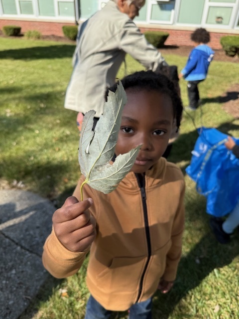 student with a leaf
