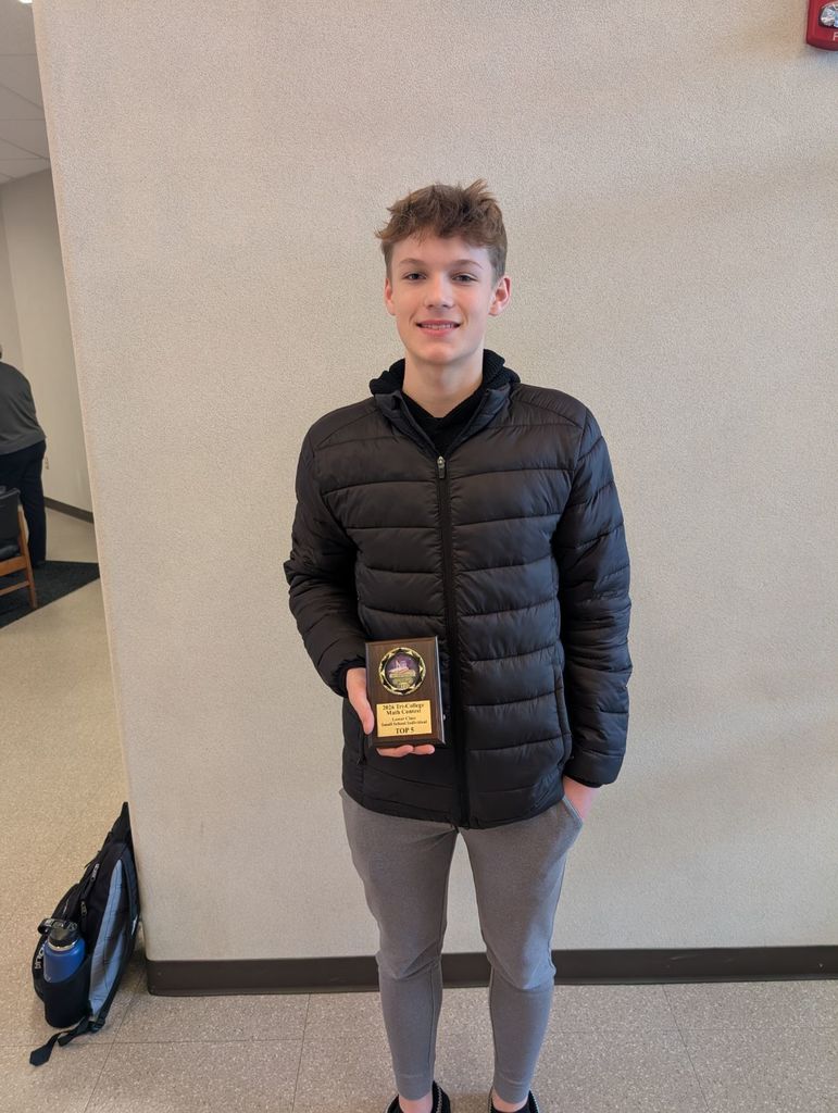 Eli Beneda with award