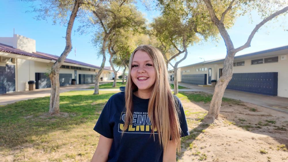 Kaelen with a big smile in the courtyard at PHS