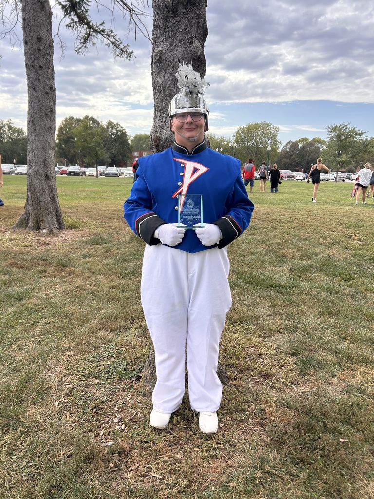 Drum Major Isaac Soulek with the 2nd place trophy.