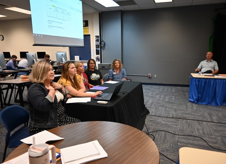 Instructional coaches speak to the USD board of education.