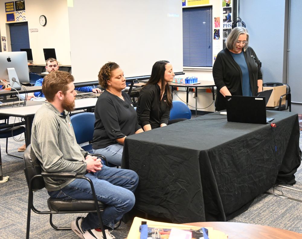 SparkWheel representatives speak to board.