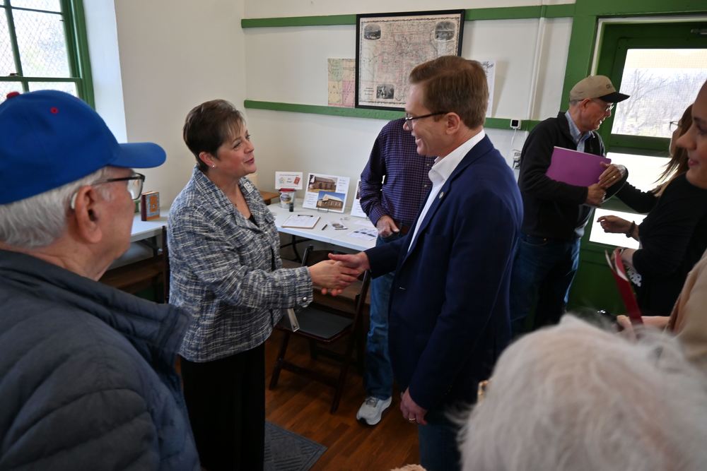 Superintendent Lori Perkins shakes hands with Lt. Gov. David Toland.