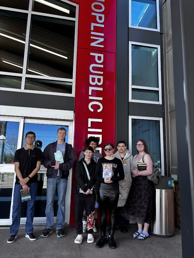 Library Club students stand in front of the Joplin Public Library.