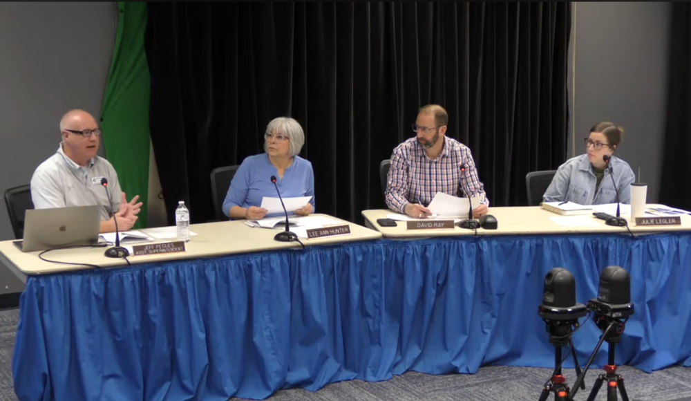 Assistant Superintendent Jeff Peguess speaks to the board.