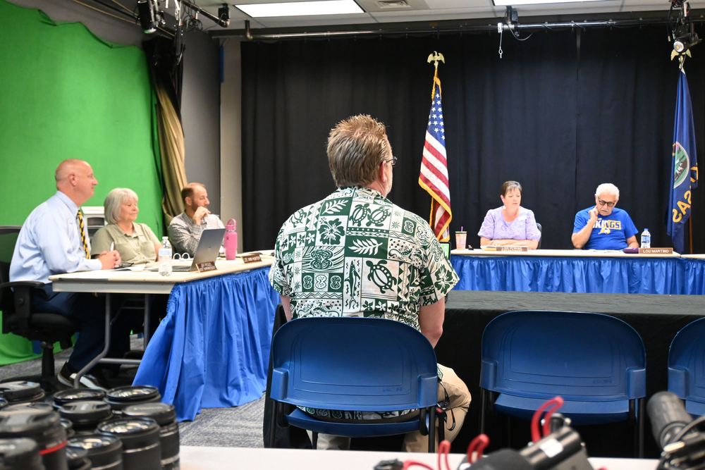 Matthew Peak speaks to the board.