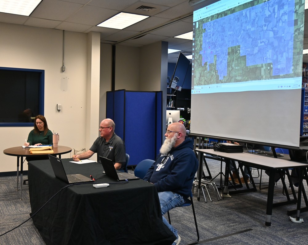 Transportation director Rick Giefer and bus driver Neil Shelley presnt information to the board on the new transportation software program.