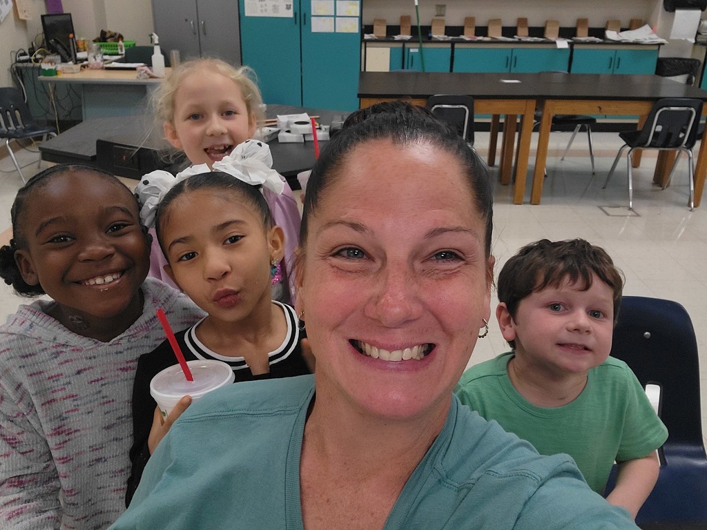 Ms. Ryan and four second grade students