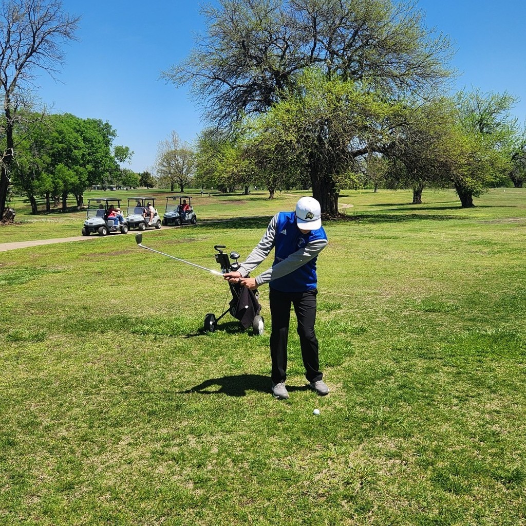 Grayson chipping on to hole 17 green.