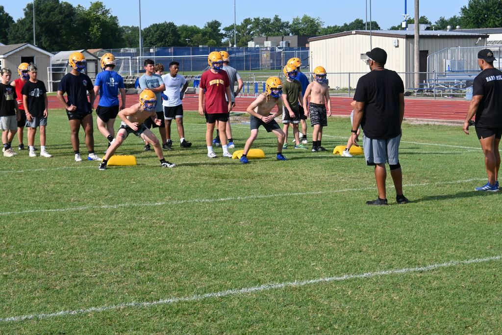 Players run drills.
