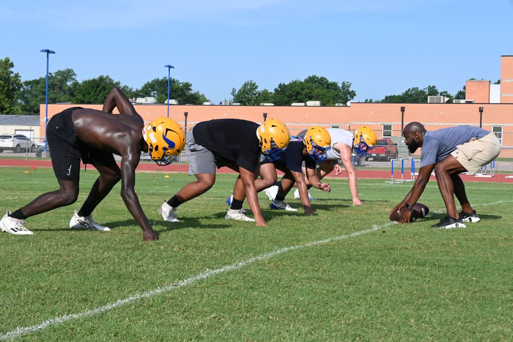 Players run drills.