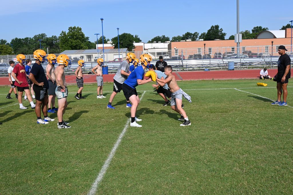 Players run drills.