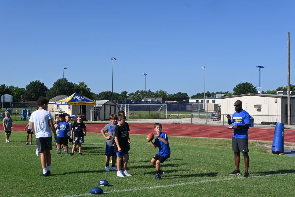 A boy prepares to pass the football.