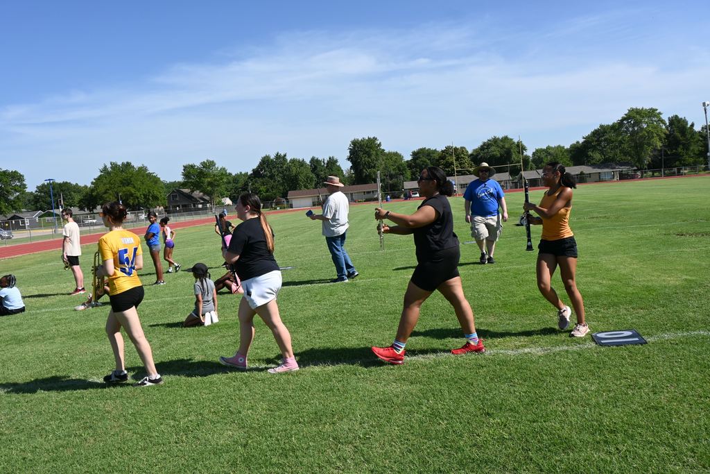 Band  and Viking Dance students practice marching formations.