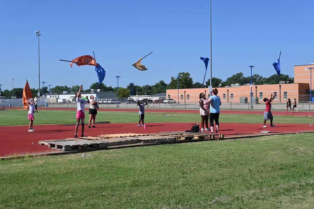 Color Guard students practice their drills for beginning of the year performances.
