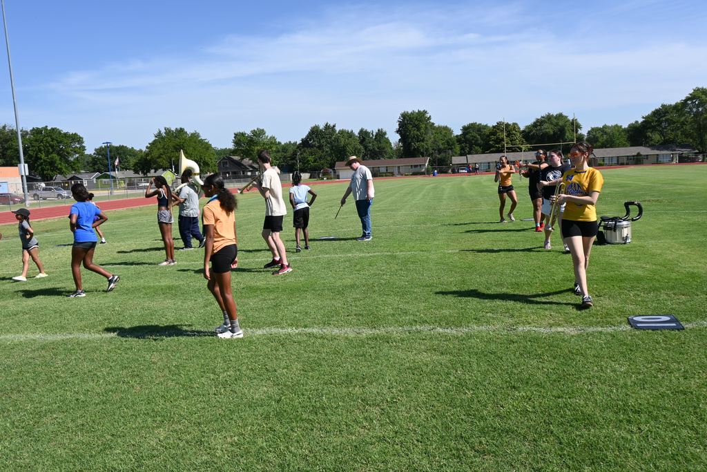 Band  and Viking Dance students practice marching formations.