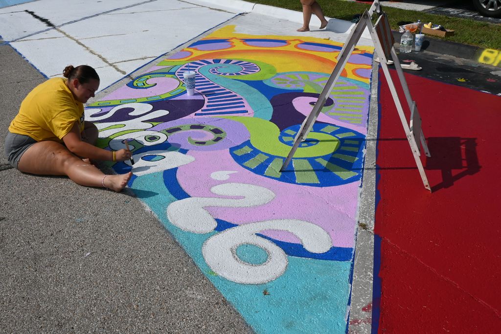 Shea Clark adds finishing touches to her senior parking space.