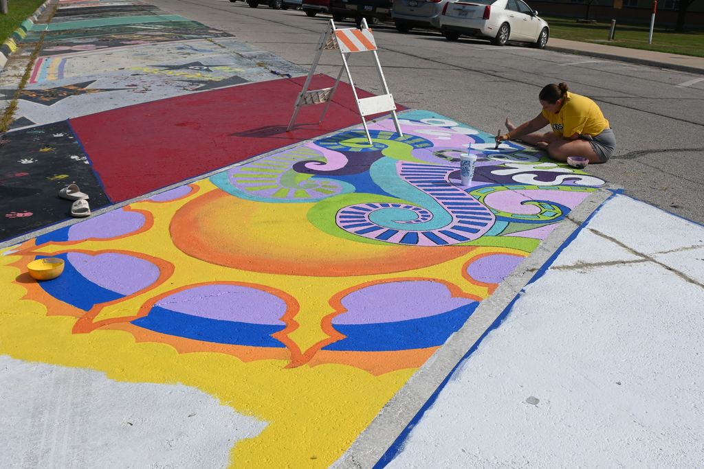 Shea Clark adds finishing touches to her senior parking space.