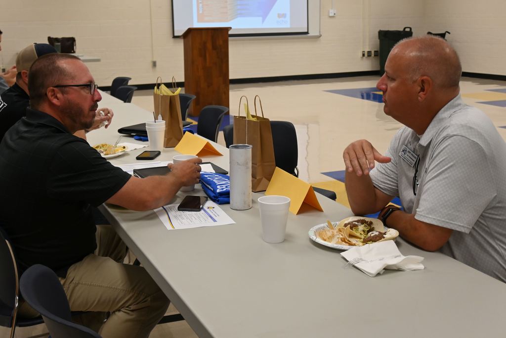 New science teacher Jeremy Stenstrom visits with Assistant Superintendent Jeff Pegues