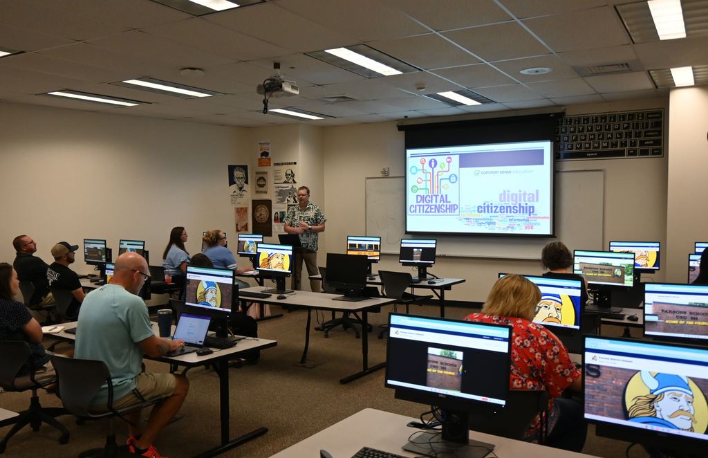 Technology Integration Specialist Matthew Peak talks to teachers about communication resources and oeprations.