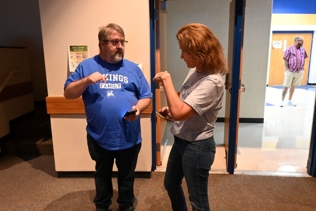Two staff members visit during the ice breaker session.