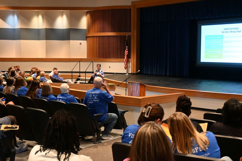 Lori Perkins speaks to staff about expectations of them working for the district.