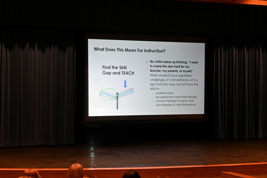 Jillian Brock speaks to PHS teachers about teaching students with autism.