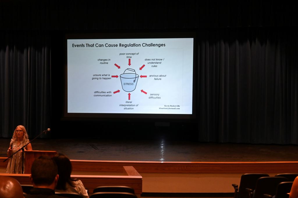 Jillian Brock speaks to PHS teachers about teaching students with autism.
