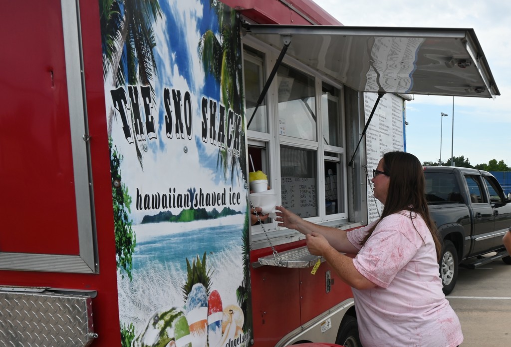 An employee receives a sno-cone