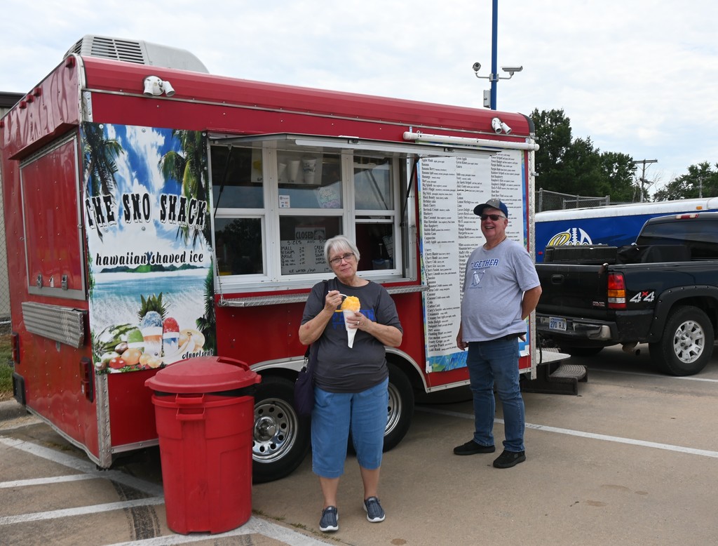 An employee enjoys an icy treat.