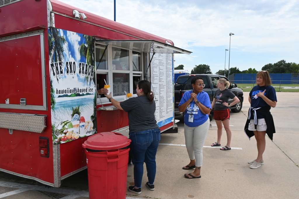An employee receives a sno-cone