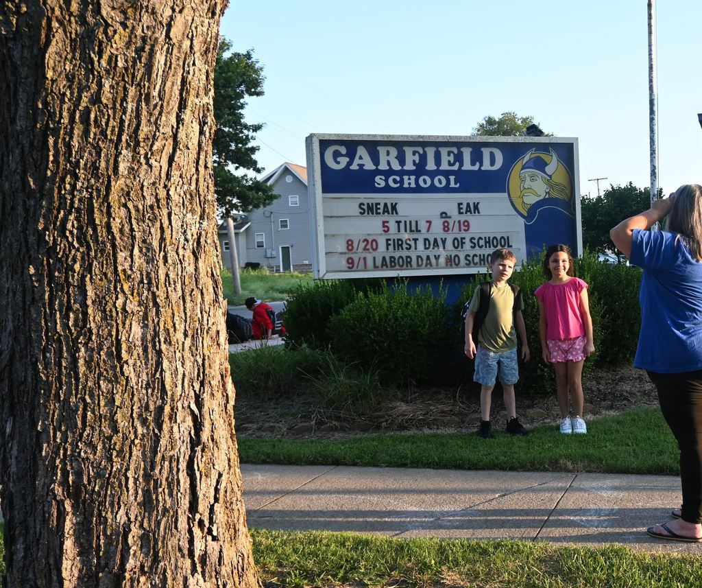 Two kids get their picture taken at Garfield.