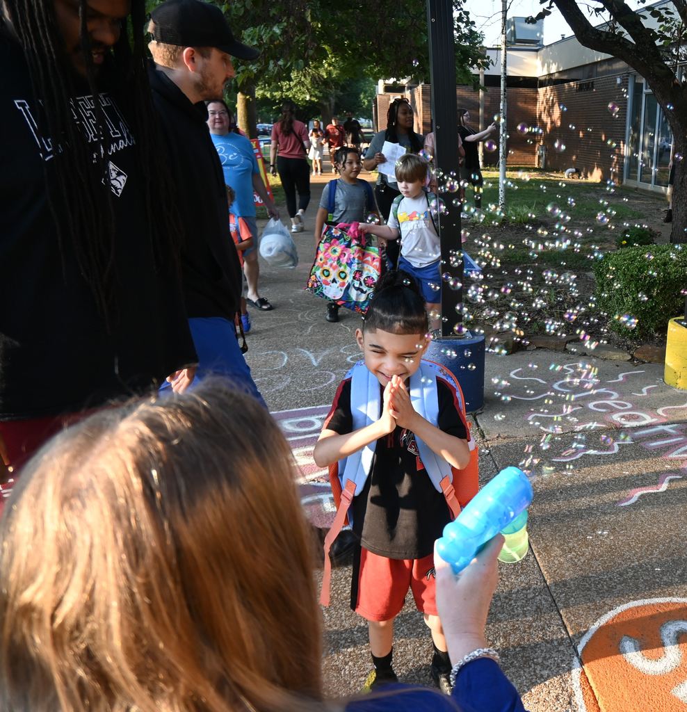 A boy plays in bubbles