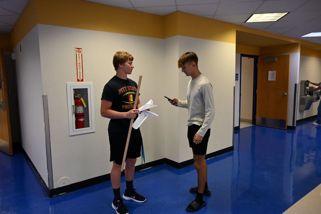 Classmates discuss their results.
