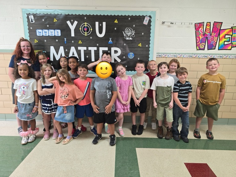 class posing on the first day of school