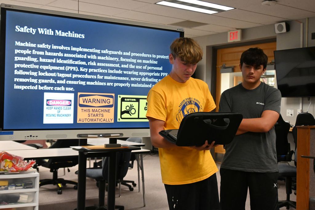 A student talks about safety with machines.