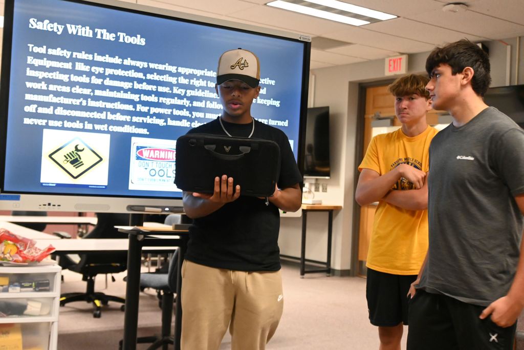 A student talks about safety with tools.