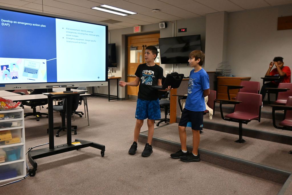 Two boys talk about developing an emergency safety plan.