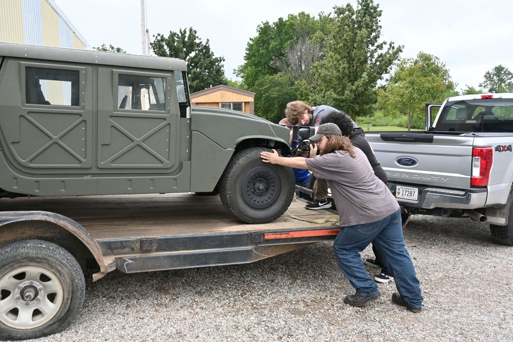 Three PHS students came to assist Mr. Rea with unloading the Humvee.