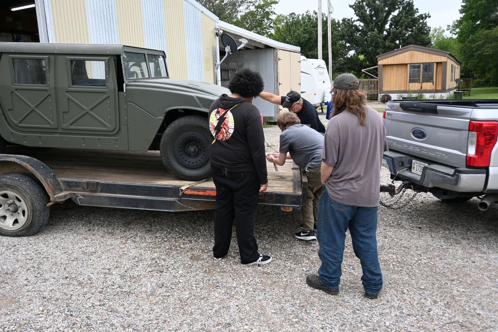 Three PHS students came to assist Mr. Rea with unloading the Humvee.
