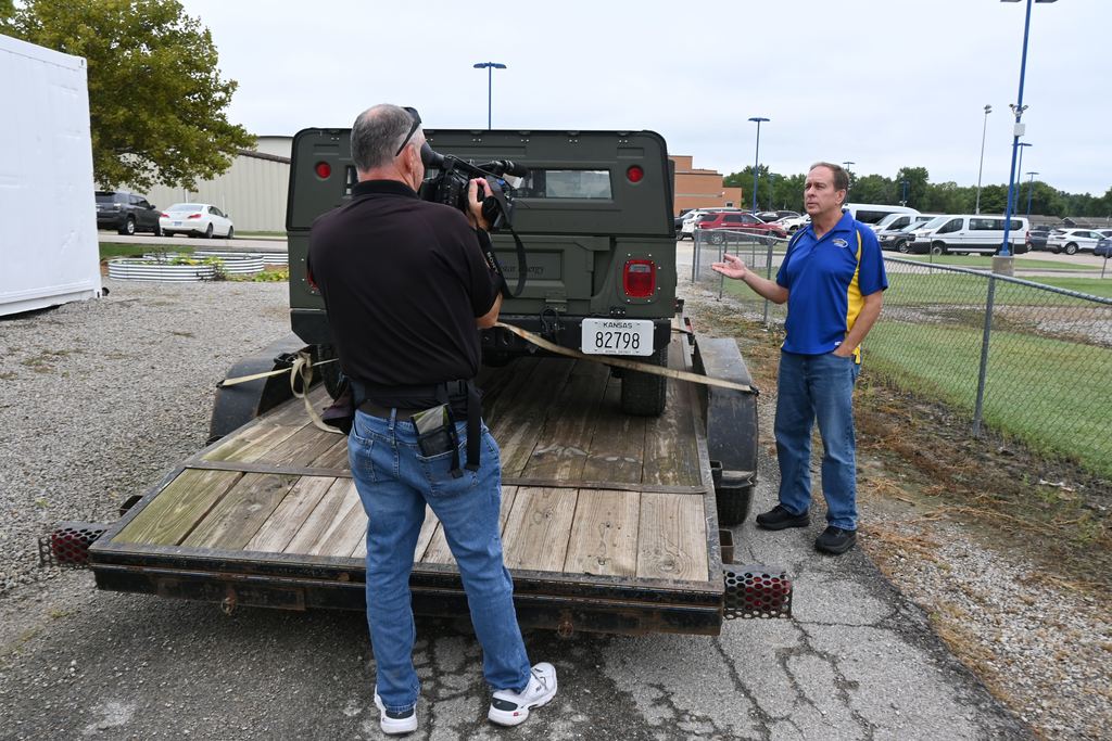 Bruce Rea visits with Darin McCann News Photographer about the history behind the humvee project.