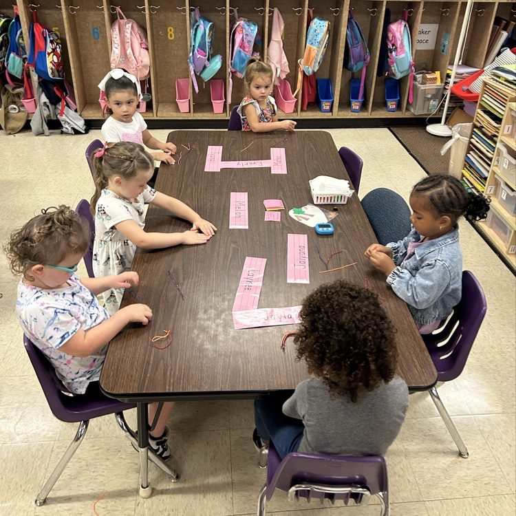 Using fine motor with Wiki sticks.