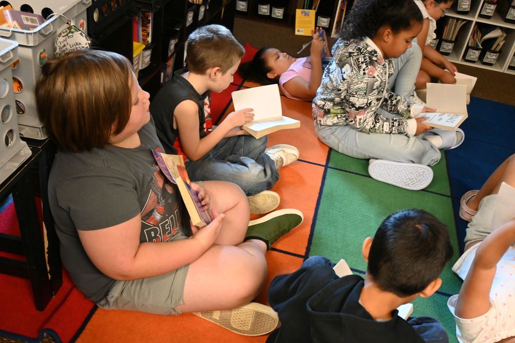 Students check out the dedication page and title page.