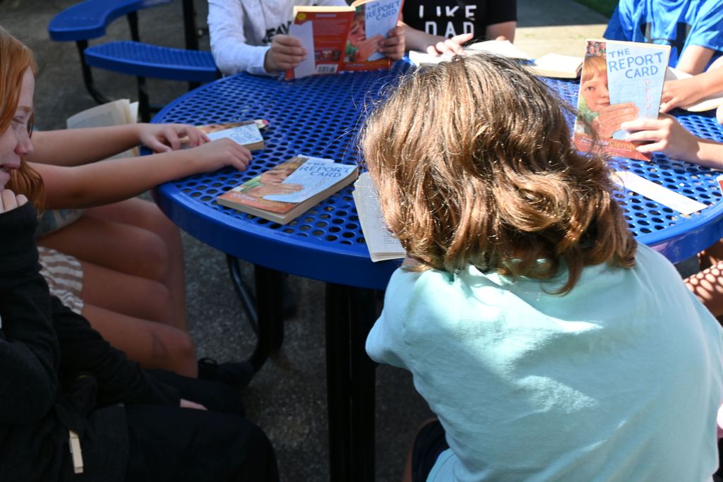 Students get ready to start reading "The Report Card".