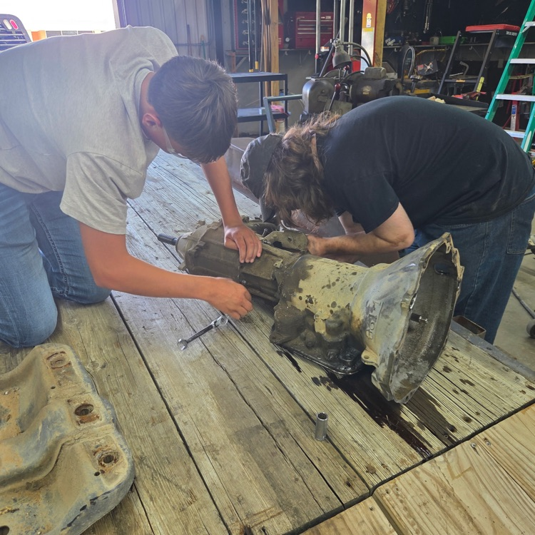 Students work on the pulled transmission.