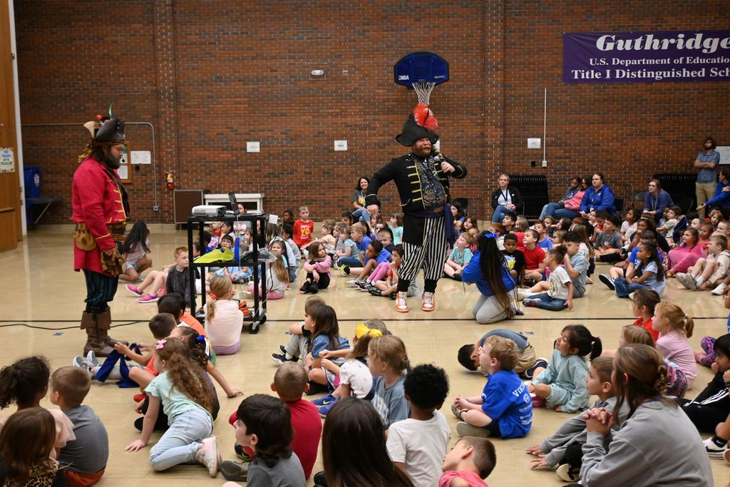 Izzy B shares stories with children.