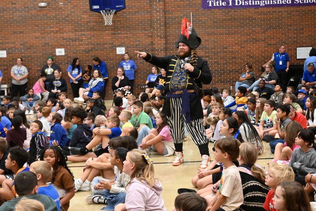 Izzy B shares stories with children.