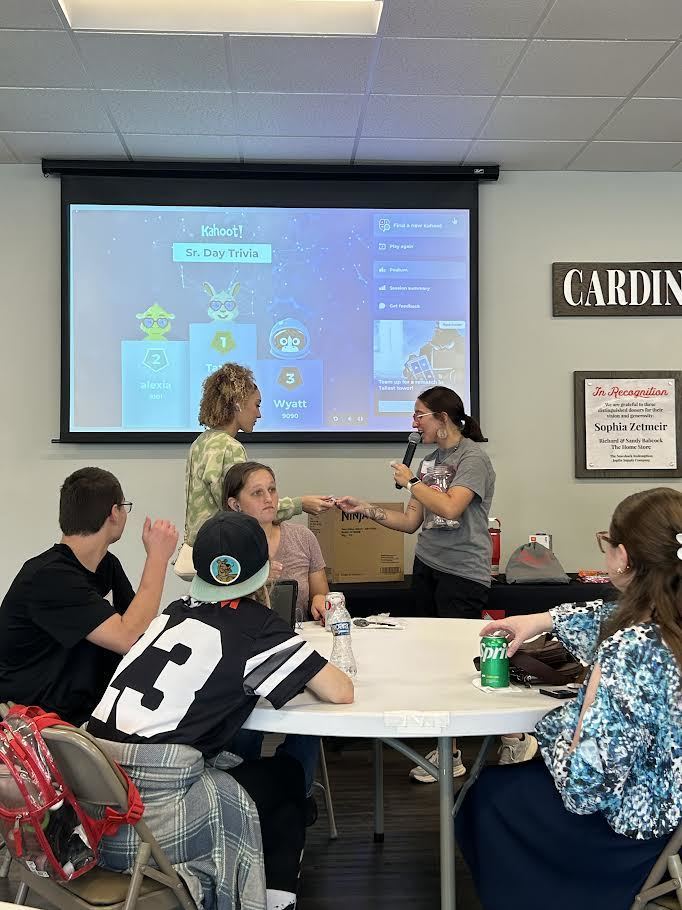 A student turns in her ticket to collect a grab bag of swag.