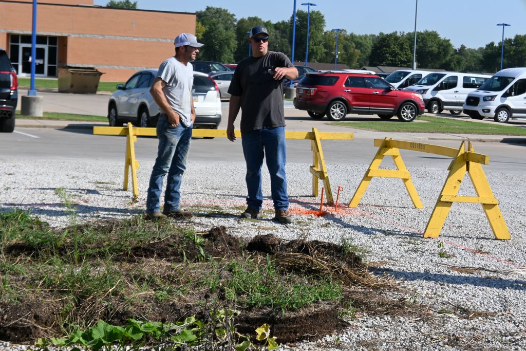 Gilpin visits with Charles Schultz about utilities abd how the foundation will be constructed to allow proper drainage.