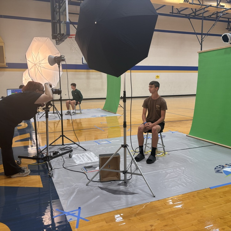 A student has his picture taken. 